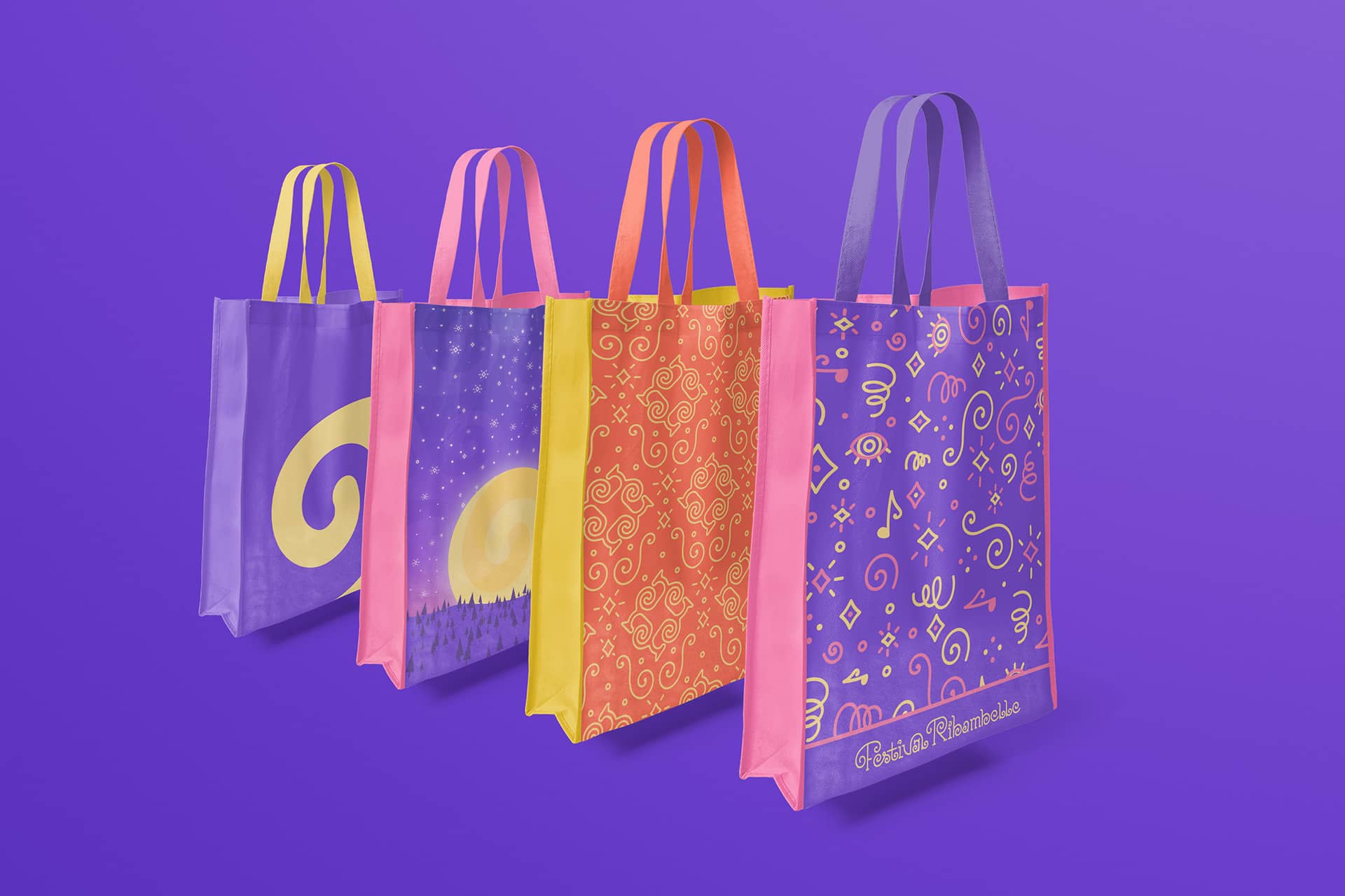 Quatre tote-bags aux couleurs et motifs du Festival Ribambelle